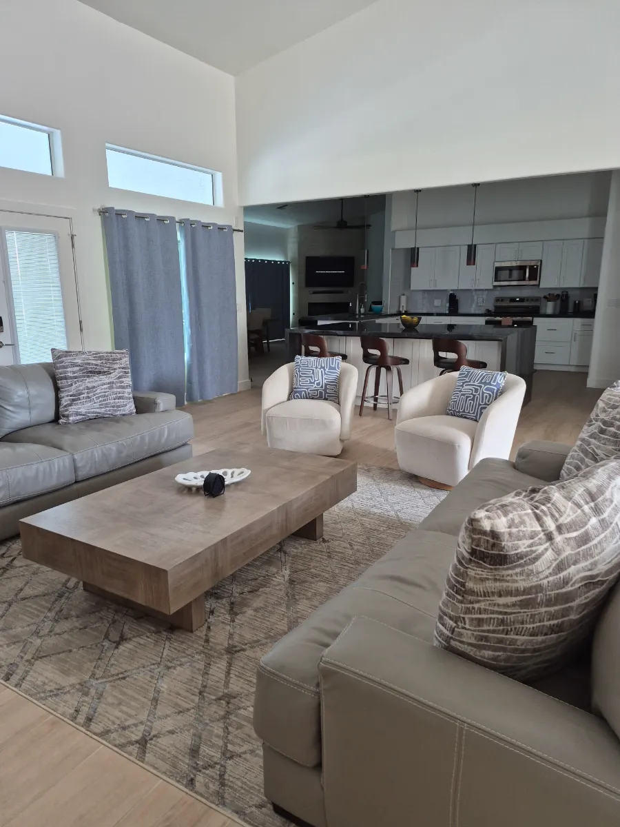 Freshly cleaned living room with sofas and rug