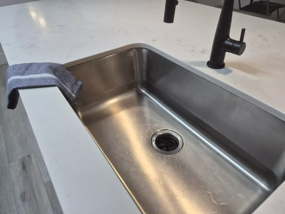 Stainless sink polished to a mirror shine, cleaned by Tidy Up Solutions Cleaning Services in the Phoenix area