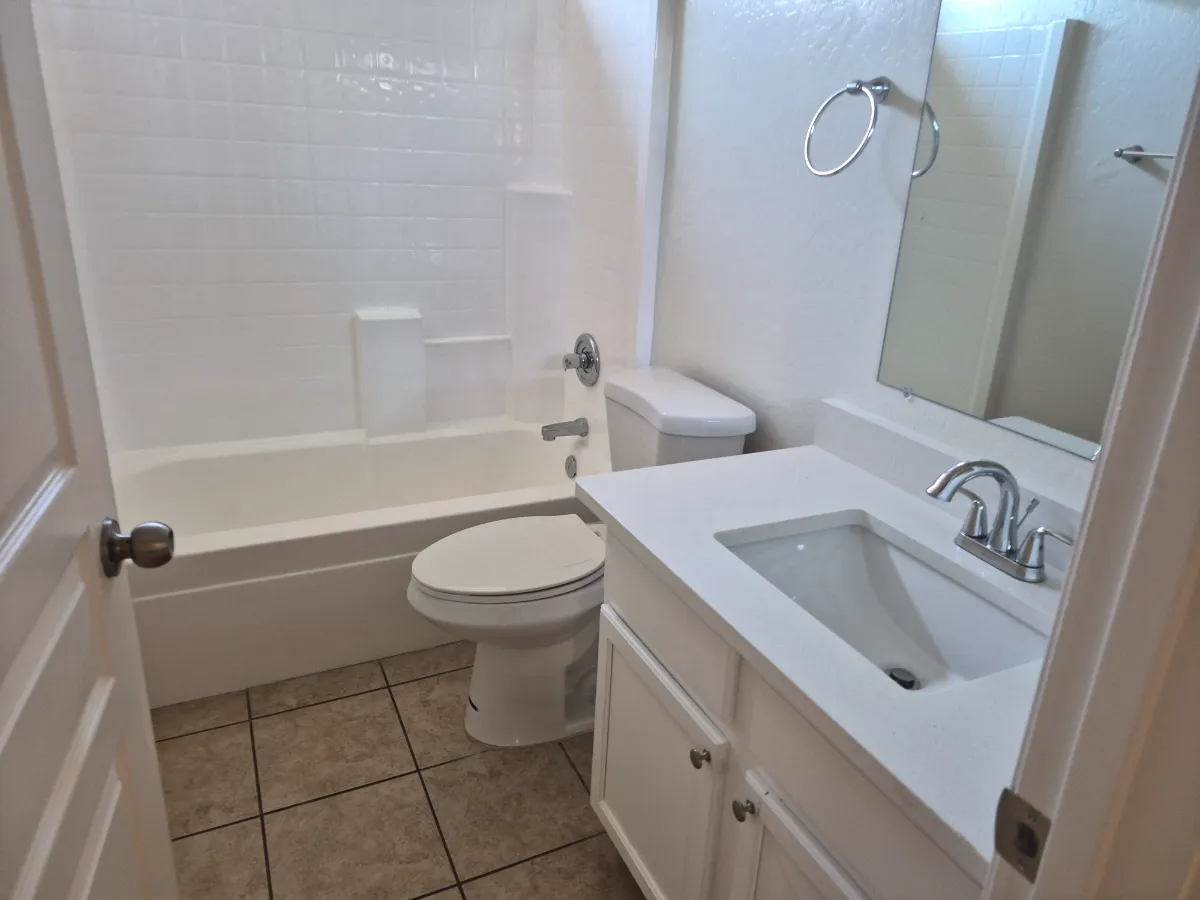Tub, vanity and tile floors, bright and fresh, cleaned by Tidy Up Solutions Cleaning Services in the Phoenix area